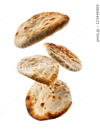 Flying and Floating Naan Bread as Crispy and Fluffy Indian Flatbreads Flying and Floating Naan Bread as Crispy and Fluffy Indian Flatbreads 123446804
