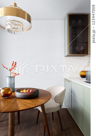 A Modern Dining Area Featuring Elegant Decor Alongside Beautiful Natural Elements 123447009