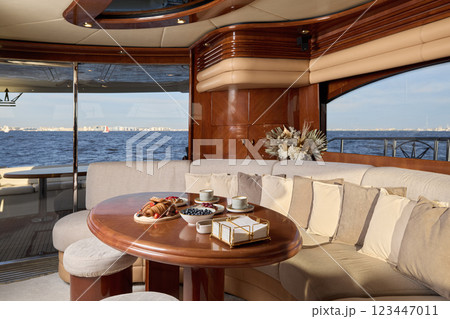A Luxurious Yacht Interior Showcasing a Stunning and Scenic, Beautiful Ocean View A Luxurious Yacht Interior Showcasing a Stunning and Scenic, Beautiful Ocean View 123447011