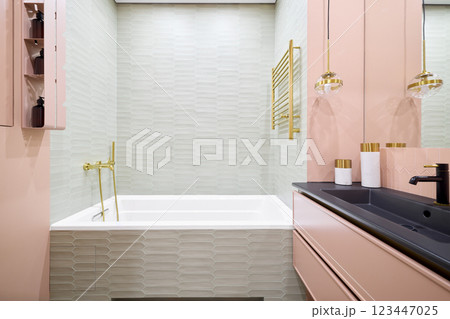 An Exquisite and Stylish Modern Bathroom Decorated with Elegant Fixtures and Soft Colors 123447025