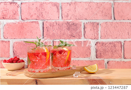Lemonade cocktail,mojito with tequila, gin, rum, vodka, liqueur, lime, ice and fresh raspberries, bar and party concept, restaurant and cafe advertising card, black background, selective focus Lemonade cocktail,mojito with tequila, gin, rum, vodka, liqueur, lime, ice and fresh raspberries, bar and party concept, restaurant and cafe advertising card, black background, selective focus 123447287