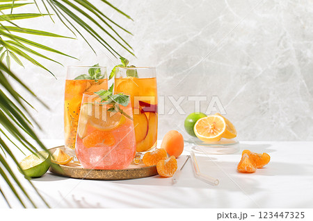 Refreshing summer drink recipeIced homemade lemonade, juice or cocktail with mint, apricots, peaches and citrus fruits, detox diet and weight loss concept, menu for restaurant, Refreshing summer drink recipeIced homemade lemonade, juice or cocktail with mint, apricots, peaches and citrus fruits, detox diet and weight loss concept, menu for restaurant, 123447325