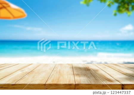 Wood table top on blurred blue sea and white sand beach background can be used for display or montage your products Wood table top on blurred blue sea and white sand beach background can be used for display or montage your products 123447337