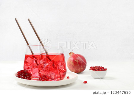 Autumn vitamin mulled wine with pomegranate pieces. Apple cider, juice or fruit drink in a glass on a sunny table, diet and weight loss concept. Granatv help cleanse the body and reduce weight. Autumn vitamin mulled wine with pomegranate pieces. Apple cider, juice or fruit drink in a glass on a sunny table, diet and weight loss concept. Granatv help cleanse the body and reduce weight. 123447650