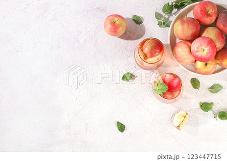 Apple and pear cider, juice or fruit drink and ingredients on a sunny table. Concept of detox diet and weight loss. Apples and pears help cleanse the body and reduce weight. Healthy food, body 123447715