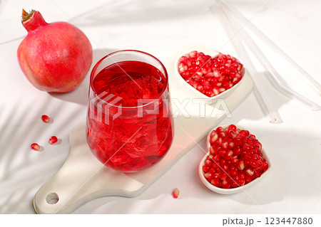 Fruit pomegranate juice and ingredients, summer pomegranate drink on bright table, detox diet and weight loss concept, healthy and natural food, source of vitamin C, selective focus, space for text 123447880