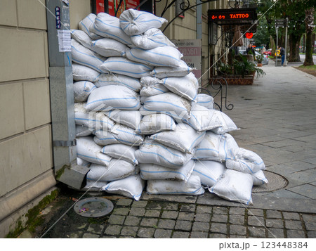Bags with building materials on the street. Preparing to refurbish the store. 123448384