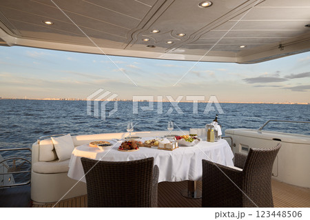 Discover an Elegant Dining Experience on a Luxury Yacht with a Stunning Oceanview Discover an Elegant Dining Experience on a Luxury Yacht with a Stunning Oceanview 123448506