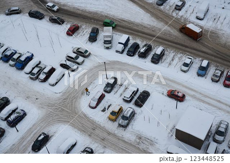 Aerial view of a snowcovered parking lot during the cold winter season showcasing vehicles, 123448525