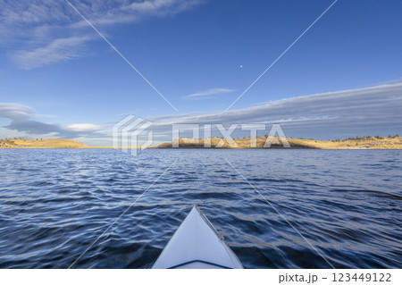winter sunset kayaking or canoeing on Horsetooth Reservoir near Fort Collins, Colorado - POV paddler perspective winter sunset kayaking or canoeing on Horsetooth Reservoir near Fort Collins, Colorado - POV paddler perspective 123449122