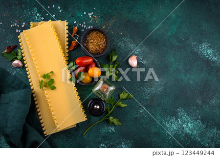 Uncooked lasagna pasta with cooking ingredient 123449244