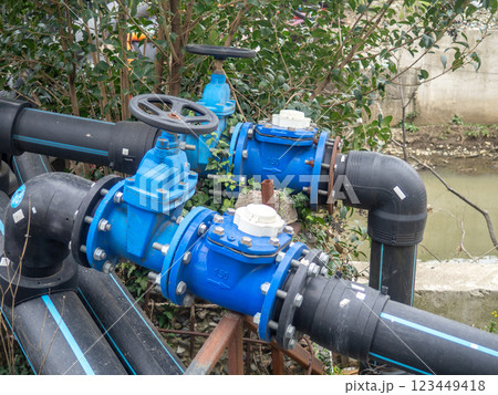 Gas pipes with valves on the street. Communications in the city. Gas pipeline on the street.  Gas supply concept 123449418
