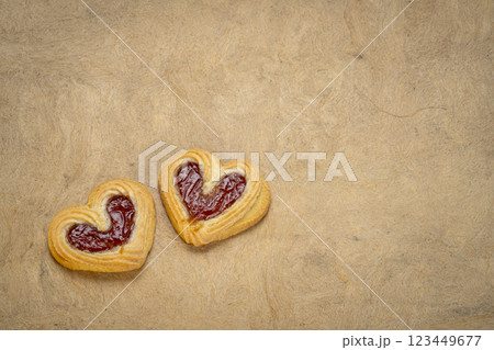 a couple of jam heart biscuits on bark art  paper, love or romance concept 123449677
