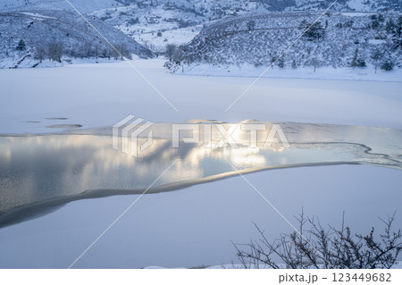 partially frozen Horsetooth Reservoir in Colorado foothills at dusk 123449682
