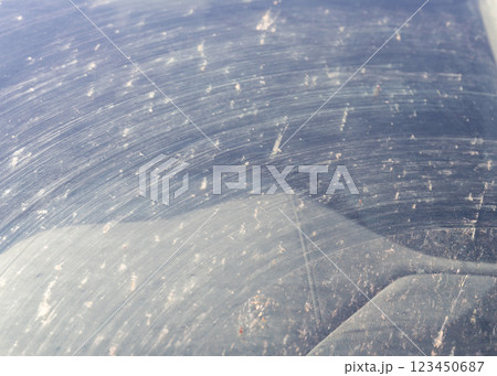 Smeared and dirty front windshield of a vehicle after hitting bugs. Smeared and dirty front windshield of a vehicle after hitting bugs. 123450687