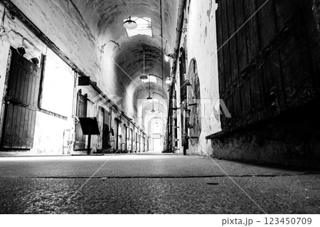 Floor level point of view of a lit cellblock of Eastern State Penitentiary historic site. 123450709
