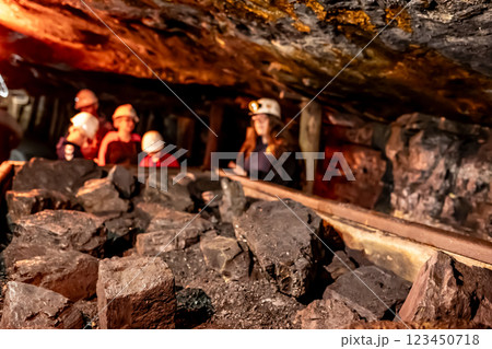 Selective focus on anthracite coal on a hopper with defocused group in the Lackawanna Coal Mine Tour at McDade Park. Selective focus on anthracite coal on a hopper with defocused group in the Lackawanna Coal Mine Tour at McDade Park. 123450718