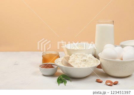 Kitchen background for baking and cooking cake,bread,confectionery and ingredients for cooking,milk,honey,flour,salt,sugar,eggs and cream on pastel background with place for text,selective focus, 123451397