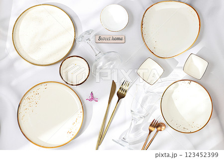 Elegant festive table setting. Set of beautiful cutlery on a marble background, menu layout in a cafe or restaurant, festive composition with a bouquet of hyacinths, kitchen background. Selective Elegant festive table setting. Set of beautiful cutlery on a marble background, menu layout in a cafe or restaurant, festive composition with a bouquet of hyacinths, kitchen background. Selective 123452399