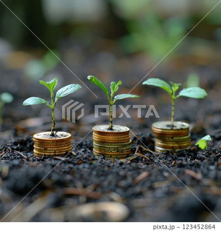 Small plants sprout from stacks of coins symbolizing a harmonious relationship between nature and finance. This depiction draws attention to investment in sustainability. 123452864