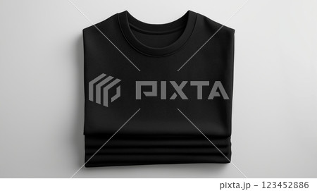 Black folded sweatshirt on a neutral background showcasing minimalist design 123452886