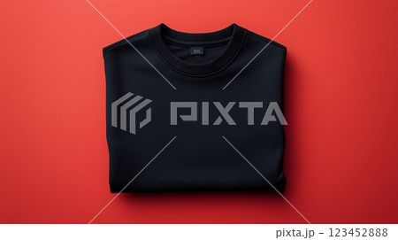 Black sweatshirt showcased on a vibrant red background for style lovers 123452888
