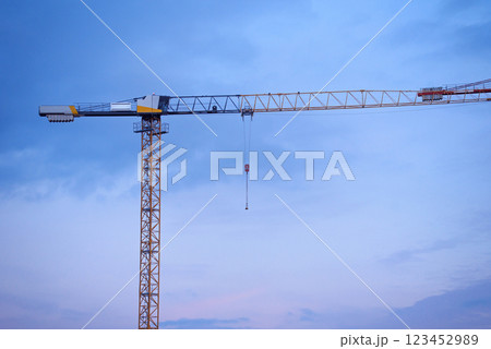 Construction cranes on the background of the sky at sunset. Construction of new residential complex. Construction cranes on the background of the sky at sunset. Construction of new residential complex. 123452989