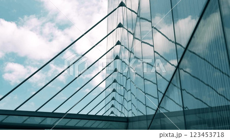 The glass facade of the modern office building reflects the sky The glass facade of the modern office building reflects the sky 123453718