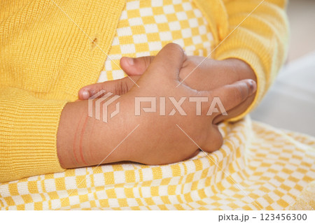 Child experiencing discomfort while holding stomach at home 123456300