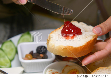 Toast with jam and assorted sides in a cozy breakfast setting Toast with jam and assorted sides in a cozy breakfast setting 123456317