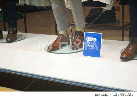Elegant footwear display in a retail store with tax-free offer 123456323