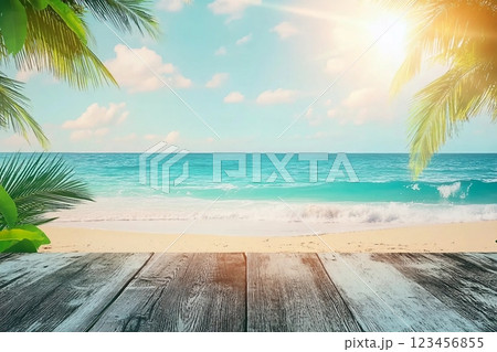 Blur tropical beach with bokeh sun light wave and palm tree on copy space empty old wood table abstract background. Product presentation in nature. Vintage tone filter effect color style. 123456855