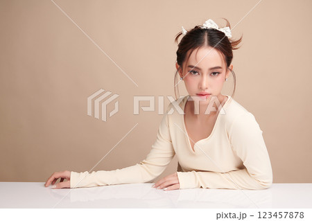 Beautiful young asian woman with clean fresh skin on beige background, Face care, Facial treatment, Cosmetology, beauty and spa, Asian women portrait. 123457878