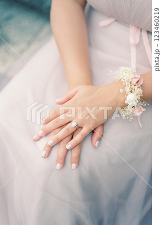 Bride sits with her hands folded on her lap. Cropped. Faceless Bride sits with her hands folded on her lap. Cropped. Faceless 123460219