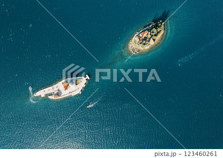 Island of Gospa od Skrpjela is opposite the island of St. George in the Bay of Kotor. Top view Island of Gospa od Skrpjela is opposite the island of St. George in the Bay of Kotor. Top view 123460261