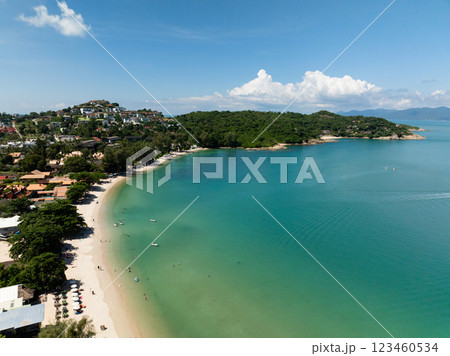 Tropical beach surrounded by green hills, turquoise water, and sunny skies, perfect for relaxation and leisure. Koh Samui, Thailand. Tropical beach surrounded by green hills, turquoise water, and sunny skies, perfect for relaxation and leisure. Koh Samui, Thailand. 123460534