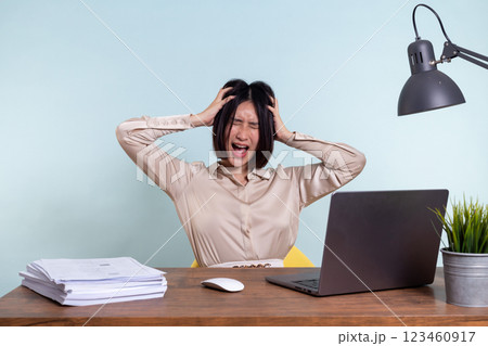 Tired, exhausted Asian woman with a laptop, problems with the project, feeling depressed, laziness in office 123460917
