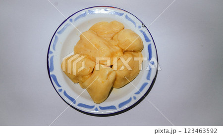 Cassava tape or tapai cassava on a plate with white background 123463592
