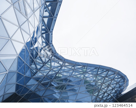 Glass facade Steel curve frame Modern building blue reflection Architecture details Futuristic background 123464514