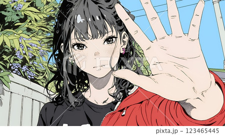 手のひらを相手に向けて見せるジェスチャーをして拒否の意思を表している若い女性
