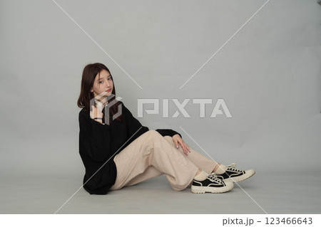 Casual teen fashion captured with a young girl in a cozy hoodie, a blank slate for your design. Casual teen fashion captured with a young girl in a cozy hoodie, a blank slate for your design. 123466643