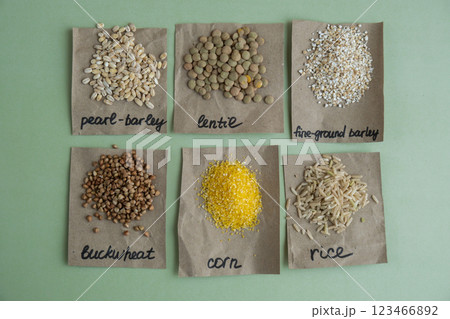 Refillable raw grain porridge with text in paper examples. Refill product format eco-friendly living. Whole spelt grain species. High protein fiber-rich vegan plant based food ingredient. Gluten free Refillable raw grain porridge with text in paper examples. Refill product format eco-friendly living. Whole spelt grain species. High protein fiber-rich vegan plant based food ingredient. Gluten free 123466892