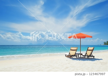 Beach chairs on the white sand beach with cloudy blue sky and sun 123467997
