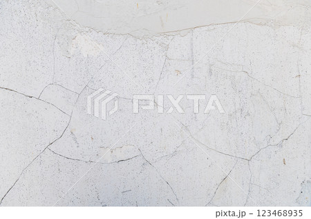 Light cracked wall. Minimalistic soft wall texture with cracked details. 123468935