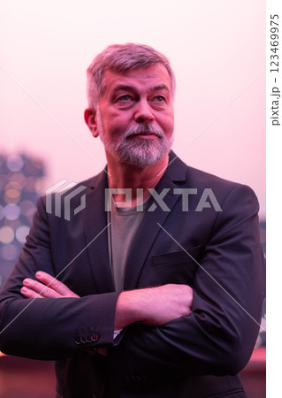 Confident Senior Gentleman with a Smile in an Urban Cityscape. 123469975