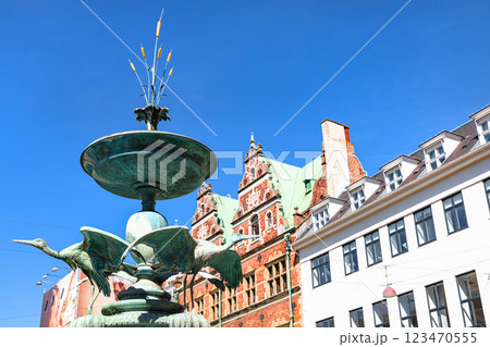The famous Stork fountain and traditional old houses on the street in the center of Copenhagen. 123470555