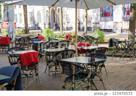 Cozy street cafe with empty tables on a summer day. 123470572