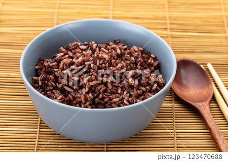 Healthy cooked brown rice mixed with riceberry in a grey ceramic bowl. 123470688