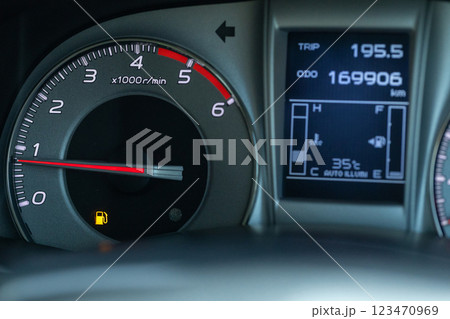 Empty fuel warning light in car dashboard. Empty fuel warning light in car dashboard. 123470969