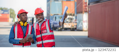 Foreman or worker work at Container cargo site check up goods in container. 123472231